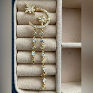 Brand new pair of asymmetric patronal star earring.